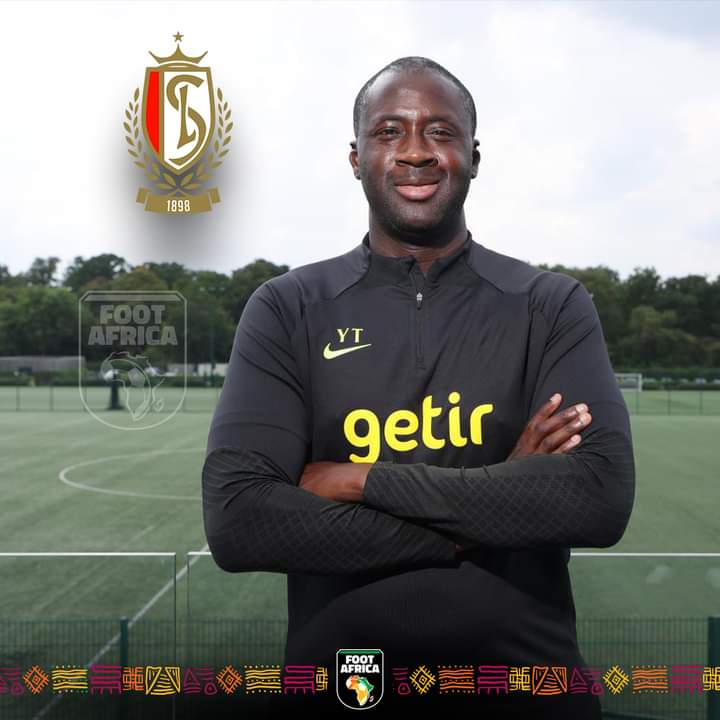 Image de Football. La star du ballon rond, Yaya Touré, qui a entamé une carrière d'entraîneur depuis peu, a été désigné comme entraîneur adjoint du club belge, le Standard de Liège. Alors qu'il était entraîneur des U16 de Tottenham, en Angleterre, l'ancien pensionnaire de Manchester City et du Barcelone FC a l'occasion de suivre une équipe de la première division Belge. J'espère qu'il aura le temps de mieux apprendre afin d'obtenir une titularisation au top niveau. Toutes nos félicitations au meilleur milieu de terrain de l'histoire du football ivoirien. Que pensez vous de cette nomination ?