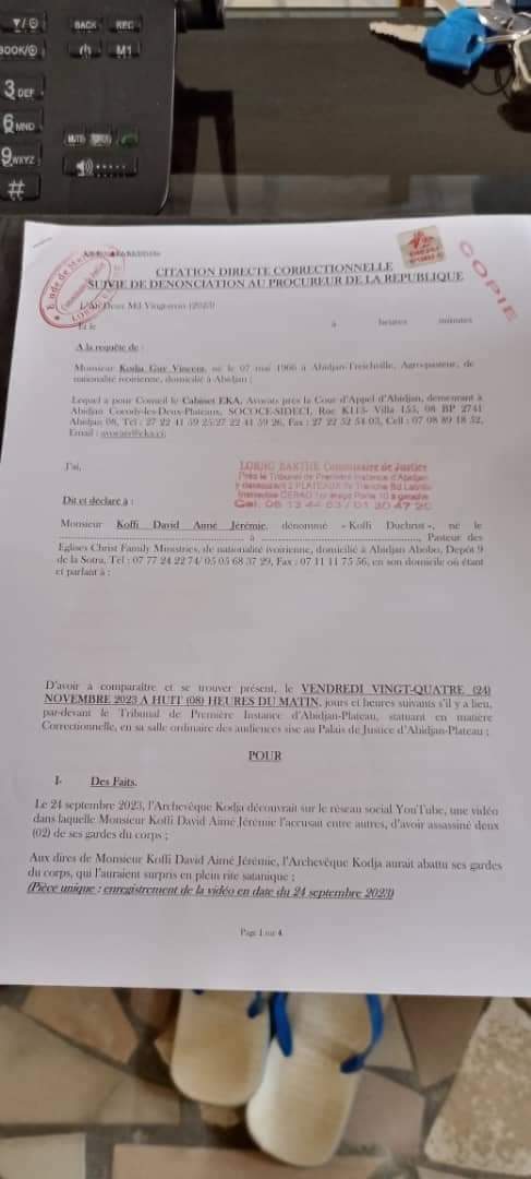 Deuxième Image de Société. Le Pasteur David Jérémie se retrouva au cœur d'une controverse inattendue lorsqu'il fut interpellé par les forces de l'ordre en plein culte, diffusé en direct sur la plateforme méta. Cette arrestation spectaculaire survint après que le pasteur ait décliné une convocation judiciaire émanant de l'archevêque Kodja Guy Vincent, une figure religieuse éminente en Côte d'Ivoire. Le différend entre les deux hommes de foi prit racine dans des allégations graves proférées par le Pasteur David à l'encontre de l'archevêque Kodja. Ce dernier aurait été accusé par le pasteur d'être impliqué dans la mort tragique de deux de ses gardes du corps. Ces accusations, largement médiatisées, déclenchèrent un tumulte sans précédent dans la sphère religieuse ivoirienne. L'archevêque Kodja Guy Vincent, profondément troublé par ces affirmations, exprima son désir ardent de voir le pasteur David se présenter devant la justice pour clarifier ses accusations et fournir les preuves substantielles à l'appui de ses allégations. Cependant, le refus catégorique du pasteur de répondre à la convocation judiciaire attisa davantage les flammes de la polémique et suscita des débats intenses au sein de la communauté religieuse et du public en général. Cette affaire délicate fit écho à un débat plus large sur la liberté d'expression et la responsabilité des personnalités religieuses dans la société. Certains défendirent le droit du pasteur à exprimer ses opinions, invoquant la protection de la liberté d'expression, tandis que d'autres soulignèrent l'importance de la responsabilité et de la véracité des allégations, surtout lorsqu'elles impliquent des personnalités aussi respectées que l'archevêque Kodja Guy Vincent. La diffusion en direct de l'arrestation du pasteur David durant son office religieux sur la plateforme méta suscita un débat sans précédent sur l'utilisation des médias sociaux dans la transmission d'événements en direct et leur impact sur la perception du public. Certains observateurs critiquèrent vivement cette exposition médiatique, la qualifiant d'irrespectueuse envers le lieu saint et remettant en question les limites éthiques de la retransmission en direct d'incidents sensibles. Pendant ce temps, les autorités judiciaires et religieuses tentaient de calmer les tensions et de trouver une issue pacifique à cette querelle qui divisait profondément la communauté. Des pourparlers et des négociations étaient engagés dans l'espoir de résoudre ce différend de manière équitable et respectueuse des principes fondamentaux de la justice et de la liberté religieuse. L'impact de cet événement se fit ressentir au-delà des frontières religieuses, attirant l'attention internationale sur la question de la responsabilité des leaders religieux et de la manière dont les conflits internes peuvent être gérés dans le respect des lois et des valeurs universelles. En fin de compte, l'affaire entre le pasteur David Jérémie et l'archevêque Kodja Guy Vincent devint un symbole de la complexité des relations interreligieuses et de l'importance cruciale de la vérité, de la responsabilité et du dialogue pour résoudre les conflits et promouvoir la compréhension mutuelle au sein d'une société diversifiée.