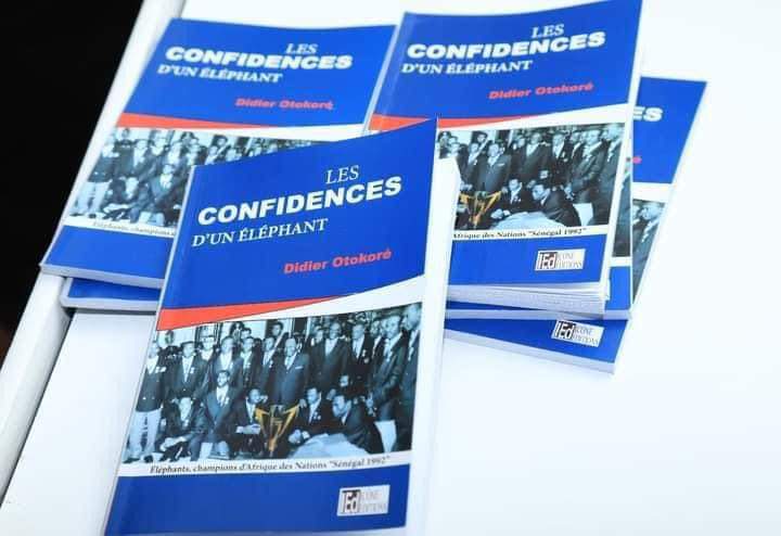 Deuxième Image de Littérature. Didier Otokoré, une légende du football ivoirien, immortalise l'épopée triomphante de l'équipe nationale dans son livre captivant, "Les Confidences d'un Éléphant". Ce récit exceptionnel offre un regard introspectif sur le périple tumultueux qui a conduit la Côte d'Ivoire à décrocher sa première étoile de Champion d'Afrique lors de la CAN 92. L'ouvrage, dévoilé avec émotion le 8 janvier 2024 au prestigieux Noom Hôtel en présence de personnalités éminentes telles que François Albert Amichia, Maire de Treichville et Président du Cocan, ainsi que d'anciens coéquipiers tels que le capitaine Gadji Celi, promet une plongée profonde dans les coulisses de cette victoire historique. La cérémonie de dédicace, empreinte d'anecdotes et de témoignages poignants, a ravivé les souvenirs émouvants du triomphe ivoirien en 1992 au Sénégal. Les 124 pages de l'œuvre, réparties en quatre chapitres, dévoilent un récit riche en détails et en émotions, capturant l'essence de cette aventure mémorable. Un aspect fascinant de l'histoire révèle les préparatifs hâtifs de l'équipe et le mystère entourant les sorciers d'Akradio. Didier Otokoré, revenant alors de la France, se retrouve confronté à des rituels mystiques auxquels il résiste initialement. C'est la ferme intervention du Capitaine Gadji Celi qui le convainc finalement de se conformer aux prescriptions des sorciers, soulignant ainsi l'importance de cette dimension mystique dans la quête de la victoire. À travers le prisme du joueur de football, le livre offre une réflexion profonde sur le rôle crucial des sorciers dans la compétition. Otokoré, au fil des matchs, prend conscience de leur influence déterminante, rendant un hommage sincère à ces figures souvent méconnues mais essentielles dans la conquête du succès. Publié par "icône Éditions", le livre est désormais accessible dans toutes les librairies et kiosques à presse au tarif de 5000 francs CFA. Cette disponibilité garantit que l'histoire captivante de "Les Confidences d'un Éléphant" est accessible à tous les passionnés de football et de littérature, préservant ainsi le précieux héritage de la CAN 92 pour les générations futures. En conclusion, "Les Confidences d'un Éléphant" transcende le simple récit sportif pour devenir une fenêtre ouverte sur l'âme du football africain, révélant les complexités, les sacrifices et la magie qui ont forgé la victoire mémorable de la Côte d'Ivoire en 1992. Un incontournable pour les amateurs de sport, les passionnés d'histoire et tous ceux qui aspirent à plonger dans les coulisses d'un triomphe inoubliable.